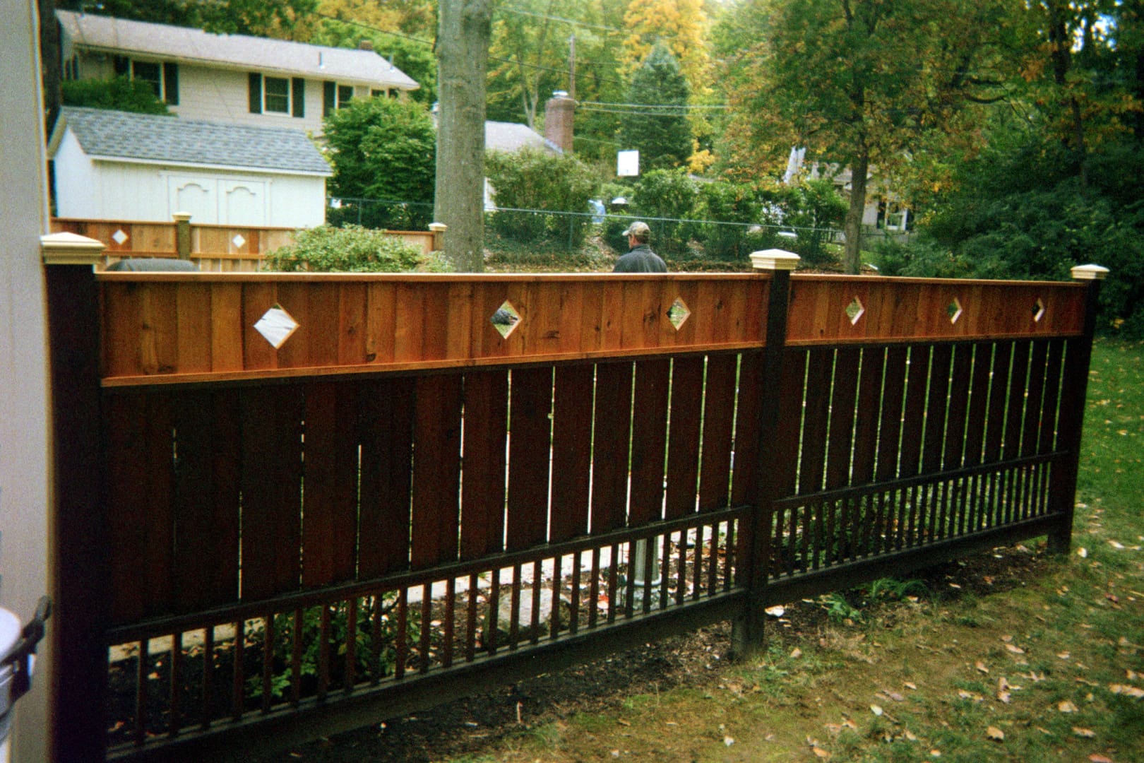 Backyard with wooden fence and trees