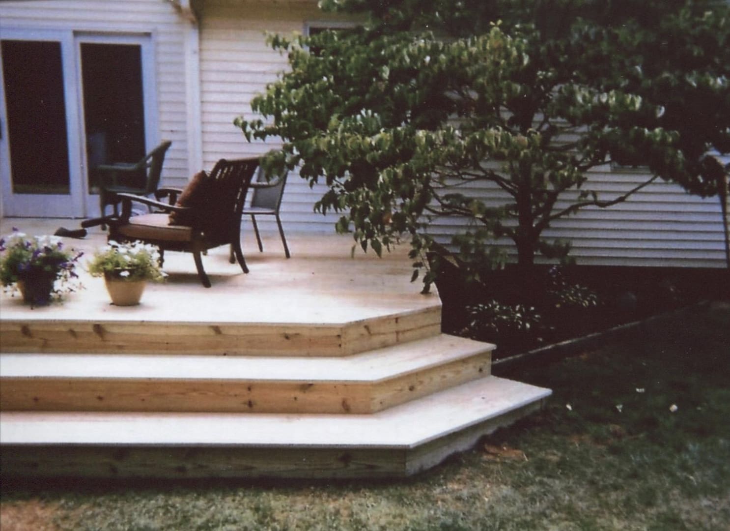 Backyard deck with potted flowers