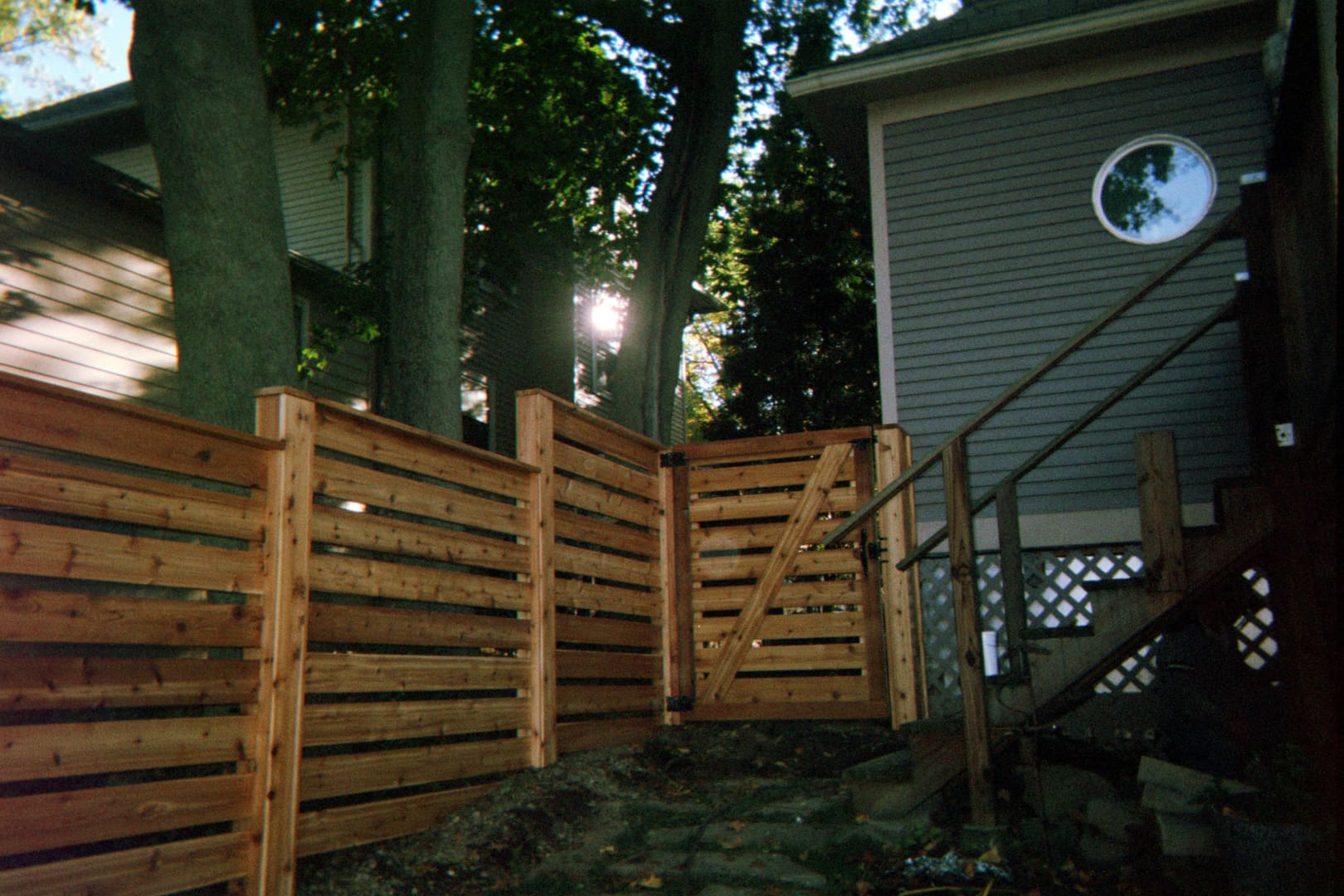Wooden fence with a gate and stairs