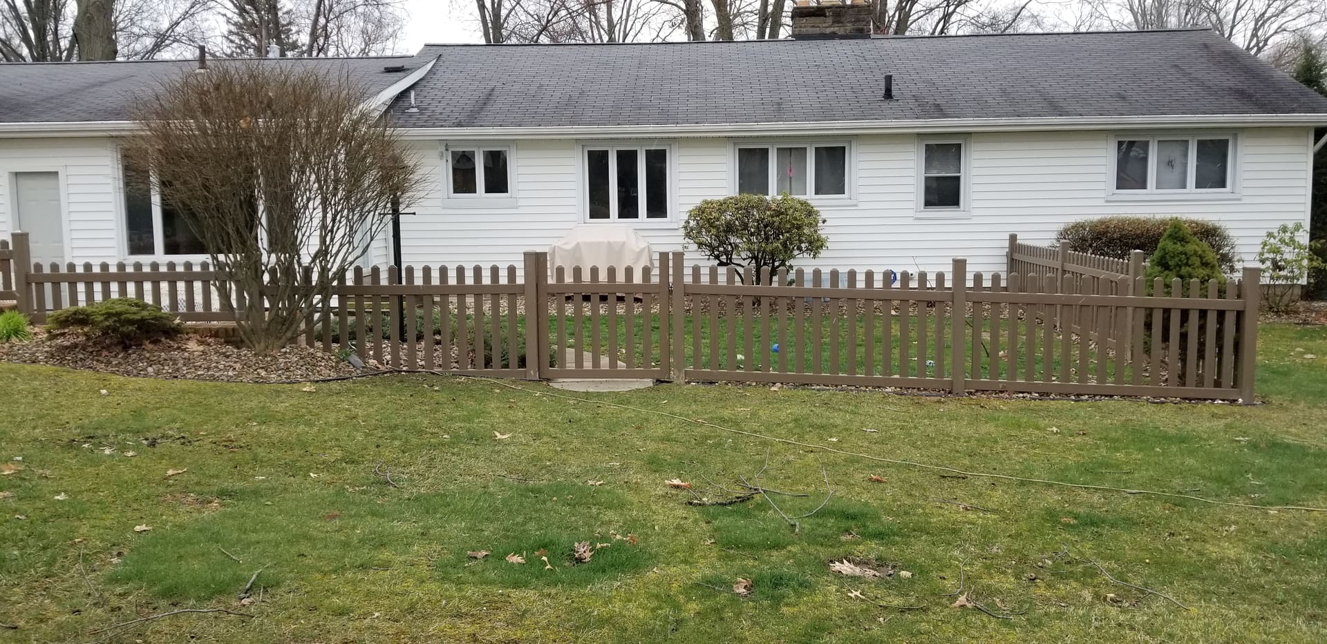 White house with wooden fence