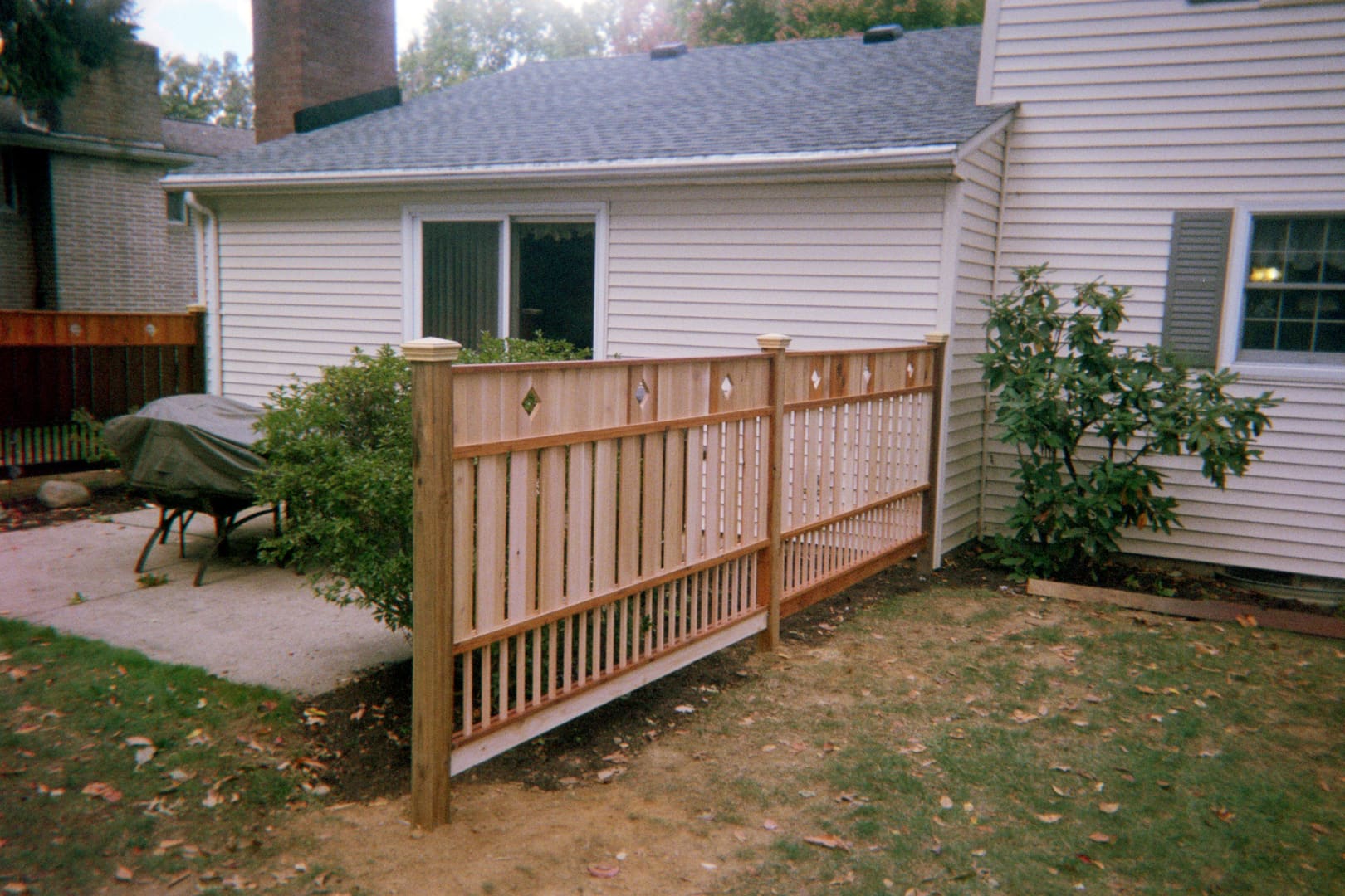 Covered grill on backyard patio